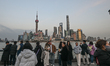 SHANGHAI, CHINA - MARCH 8: 
 Visitors and locals gather by the Huangpu River to view the...