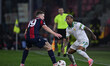 Lewis Ferguson of Bologna F.C. and Wesley of A.S. Roma are in action during the UEFA Europ...