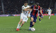 Remo Freuler of Bologna FC battles for the ball with Niccolo Pisilli of AS Roma during the...