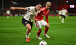 Aral Simsir of FC Midtjylland is under pressure from Omari Hutchinson of Nottingham Forest...