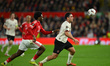 Ola Aina of Nottingham Forest puts pressure on Aral Simsir of FC Midtjylland during the UE...