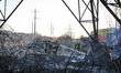 Rescue workers operate at the site of a fire that breaks out following a Russian strike wi...