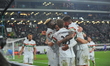 Lenny Joseph of Ferencvaros celebrates with players of Ferencvaros after scoring in the Eu...