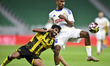 Naif Abdulraheem Alhadhrami of Qatar SC and Rayyan Ahmed Al-Ali of Al-Gharafa SC are in ac...