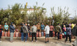 Nepali residents stand in line with empty LPG cylinders during a cooking gas shortage in K...