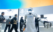 A robot dresses as a chef in front of the Robam appliance booth at the SNEIC expo center i...
