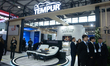 Fairgoers are seen at the Tempur booth at the SNEIC expo center in Shanghai, China, on Mar...