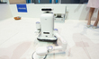 A robot performs house chores on the stage of the Haier booth at the SNEIC Expo Center in...