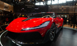 A luxurious sports car is on display at the Dreame booth at the Dreame SNEIC expo center i...
