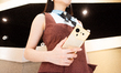 A model with the luxurious Aurora Smartphone is on display at the Dreame booth at the Drea...