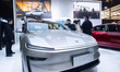 Fairgoers are seen at the Tesla booth at the SNEIC expo center in Shanghai, China, on Marc...