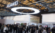 Fairgoers are seen at the Huawei booth at the SNEIC Expo Center in Shanghai, China, on Mar...