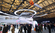 Fairgoers are seen at the Hisense booth at the SNEIC Expo Center in Shanghai, China, on Ma...