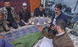 Iraqi Kurdish men play the traditional folkloric game 'Sini Sinyane' (Tray and Cups) at a...