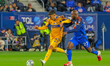 Tigres midfielder Juan Brunetta and Cincinnati midfielder Brian Anunga compete for the bal...