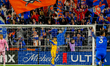 A Tigres player is seen as fans react to a goal by Cincinnati forward, Tom Barlow, during...