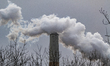 Pollution and steam rise from the stacks of the Miami Fort Power Station, which is situate...