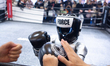 Boxing robots perform a boxing match at the Unitree booth during the second day of the AWE...