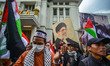 A crowd gathers under the banner of ''Bandung Protest--Artistic Solidarity for Palestine''...