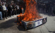 Kashmiri Shia Muslims burn mock coffins during a protest marking Quds Day in the Magam are...
