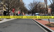 Authorities work the scene of a bomb threat in the area of 14th Street Northwest and K Str...