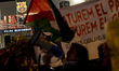 Pro-Palestinian activists gather outside the Palau Blaugrana in Barcelona, Catalonia, Spai...