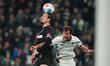 Joe Scally (Borussia Mönchengladbach) and Adam Dzwigala (FC St. Pauli   ) battle for the b...