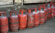 LPG gas cylinders are pictured as people queue at a gas agency amid LPG gas shortage fears...