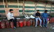 People queue at a gas agency in Kashmir, Jammu and Kashmir, India, on March 13, 2026, amid...