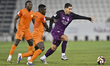 Roberto Firmino of Al Sadd SC and Michael Baidoo of Umm Salal SC are in action during the...