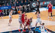 Andrew Rohde #7 of the Wisconsin Badgers attempts a layup while defended by Zvonimir Ivisi...