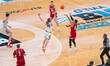 Nick Boyd #2 of the Wisconsin Badgers shoots a three-pointer over Jake Davis #15 of the Il...