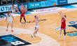 Austin Rapp #22 of the Wisconsin Badgers attempts a three-pointer over Ben Humrichous #3 o...