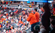 Illinois fans cheer from the upper deck during the college basketball game between the Wis...
