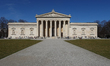 People enjoy a sunny, warm early spring day in front of the Glyptothek museum at Kunstarea...