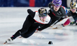 Reinis Berzins of Latvia competes in the Men's 1000m Heats during the ISU Short Track Worl...