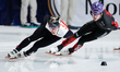 Felix Roussel of Canada and Reinis Berzins of Latvia compete in the Men's 1000m Heats duri...
