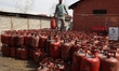 Domestic empty gas cylinders are at a gas agency in Sopore, Jammu and Kashmir, India, on M...