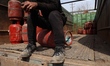 Domestic empty gas cylinders are at a gas agency in Sopore, Jammu and Kashmir, India, on M...