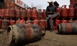 Commercial and domestic empty gas cylinders are at a gas agency in Sopore, Jammu and Kashm...