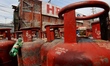 Commercial and domestic empty gas cylinders are at a gas agency in Sopore, Jammu and Kashm...