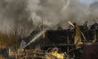 Firefighters work at an industrial facility damaged during a massive Russian missile and d...