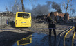 Firefighters work at an industrial facility damaged during a massive Russian missile and d...