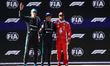 George Russell, Andrea Kimi Antonelli of Mercedes and Lewis Hamilton of Ferrari after the...