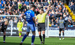 Referee Matthew Corlett shows a yellow card to Sil Swinkels of Chesterfield during the Sky...