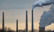 Pollution and steam rise from the stacks of the Miami Fort Power Station, which is situate...
