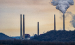 Pollution and steam rise from the stacks of the Miami Fort Power Station, which is situate...