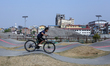 A young boy plays with his bicycle on a holiday Saturday in Kathmandu Valley, Nepal, on Ma...