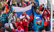 Russian supporters display the national flag during the medal ceremony in Cortina d'Ampezz...