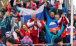 Russian supporters display the national flag during the medal ceremony in Cortina d'Ampezz...